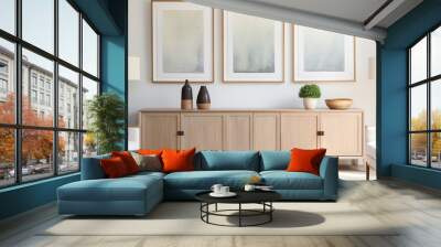 Well-lit living room featuring three white mock frames and a contemporary sideboard Wall mural