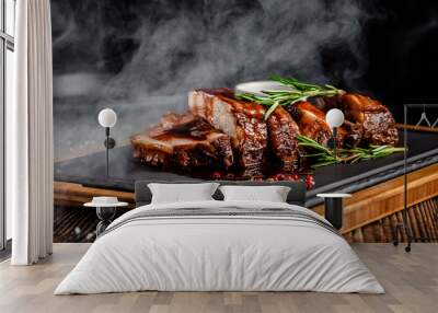 American food concept. Grilled pork ribs with grilled sauce, with smoke, spices and rosemary. Background image. copy space Wall mural