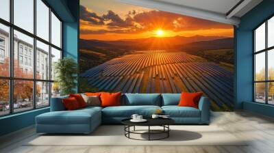 Aerial view of a large solar panel farm at sunset, with a dramatic sky and rolling hills in the background. Wall mural