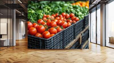 Fresh red tomatoes in black crates at a market stand. Wall mural