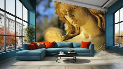 golden angel in the sunlight (antique statue) Wall mural