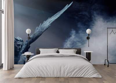 Guardian angel statue in light as a symbol of strength, truth and faith. Wall mural