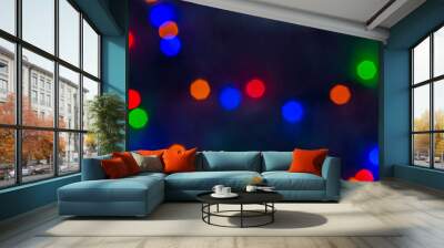 Bokeh background photo, bright colored lights on dark smoky background. Wall mural