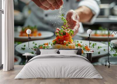 Chef expertly sprinkling spices over a gourmet dish. Wall mural