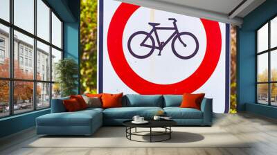 Warning sign prohibiting bicycles traffic on a post with a rural background. Wall mural