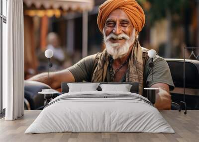 An old Indian man in casual attire riding a motorcycle in an outdoor setting Wall mural