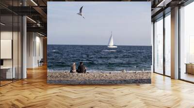 couple on sea beach with blue water horizon boat and fly seagull bird Wall mural