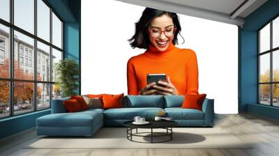 woman dressed in an orange sweater is amazed while using at her phone, png file of isolated cutout object on transparent background. Wall mural