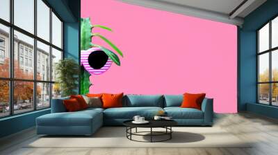 Funny cactus in sun glasses on a pink background. Wall mural