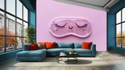 Pink sleep mask with closed eyes on it on pink background. Top view, flat layer. The concept of vivid healthy dreams. Wall mural