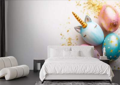 Unicorn shaped Easter eggs, colorful with gold pattern on white background. Flat lay. Place space for text. Wall mural