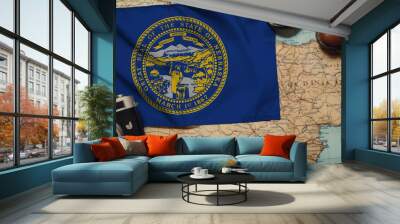 Nebraska flag on the map surrounded by camera, shoes. Travel and tourism concept Wall mural