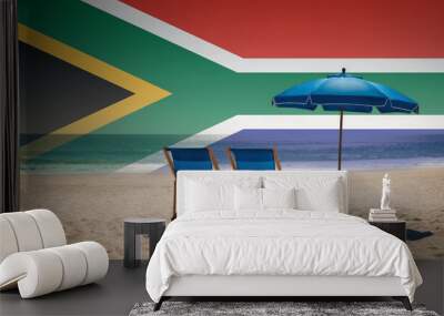 Two blue beach chairs and an umbrella await, inviting travelers to experience a relaxing South Africa beach vacation Wall mural