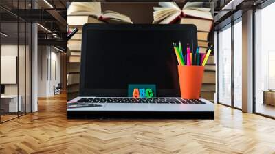 Electronic distance learning. Education concept. Internet library. Book and laptop. Wall mural