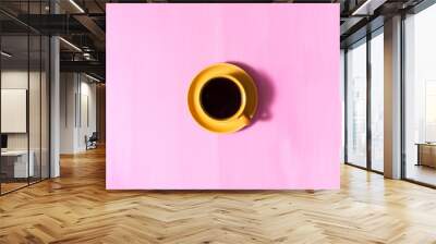 Hot black aromatic coffee americano on an old wooden pink table. Design  with copy space Hot morning coffee. Wall mural