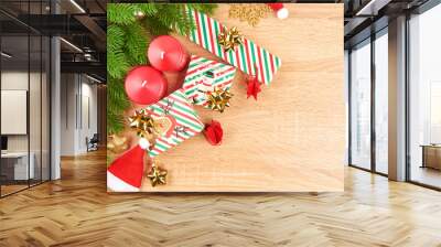 Christmas background with fir branches, various Christmas decorations, colored garlands and beads, on a light wood background. Christmas decorations. Christmas background. Space for text. Wall mural