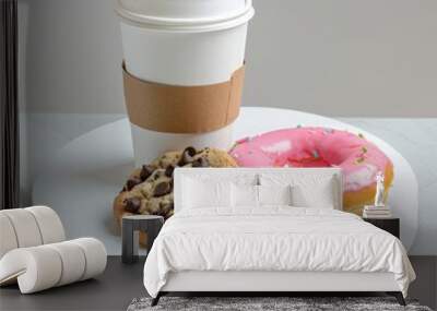 A cardboard coffee cup and two donuts are on the table Wall mural