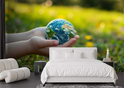 Close-up of a man's hands holding a globe of the earth. Earth Day Concept Save the World save the environment Wall mural