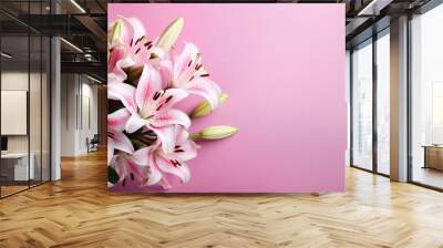 Beautiful lily flowers bouquet on a pink background. Lillies. Pink lilies closeup. Big bunch of fresh fragrant lilies purple background. Wall mural