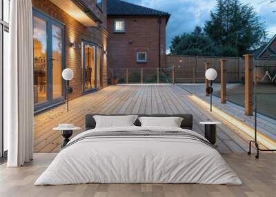 Modern wooden decking with lighting surrounding a backyard swimming pool Wall mural