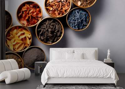 Various kind of leaf tea on a gray background, top view.	
 Wall mural