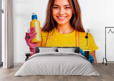 Young smiling woman holding cleaning supplies is ready for housework Wall mural