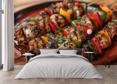 A red plate is topped with skewered chicken and peppers, creating a delicious grilled chicken shish kebab dish Wall mural