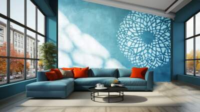 Abstract light blue background with beautiful shadow of Muslim ornament on the wall. Wall mural