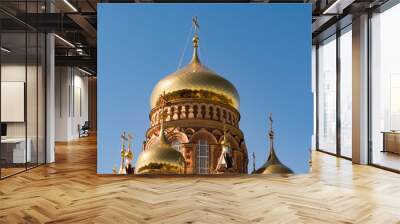 The domes of the Orthodox church against the blue sky, beautiful golden Wall mural