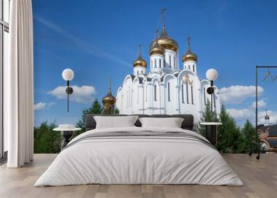 Orthodox Christian church on the background of the blue sky. Wall mural