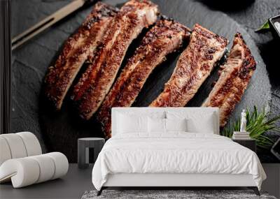 pork ribs on a grill on a stone background  Wall mural