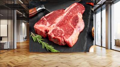 raw T-Bone Beef Steak on stone background Wall mural