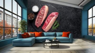 Two raw picanya steaks with spices on stone background with copy space for text Wall mural