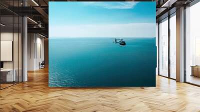 helicopter is flying over the beautiful blue sea or ocean. Rescue helicopter in search of people. tropical climate. beautiful view of the sea and clouds Wall mural