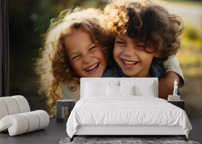 Portrait of adorable brother and sister smile and laugh together while sitting outdoors. happy lifestyle kids Wall mural