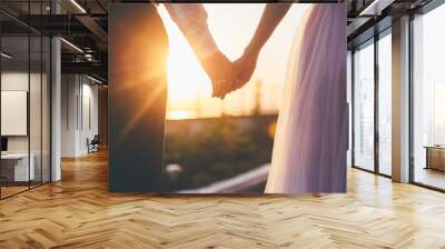 Bride and groom holding hands closeup Wall mural