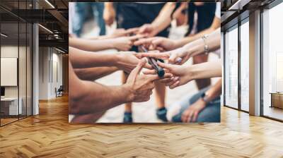 teambuilding exercises with stick and hands of colleagues Wall mural