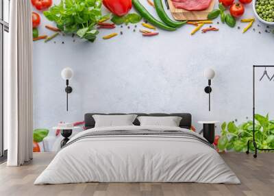 Frame for Italian food. Ingredients for pasta. Cherry tomatoes, meat, spaghetti pasta, garlic, Basil, asparagus, broccoli and spices on a grey grunge background, copy space, top view
 Wall mural