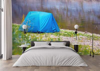 blue tent by the river on a summer day Wall mural