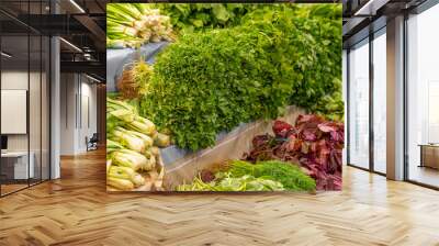 Green vegetables on market stall. Traditional food market Wall mural