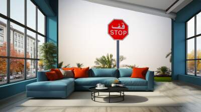 Road signs in the business center. Skyscrapers and construction. Symbol - move without stopping. Stop road sign in the UAE. Wall mural