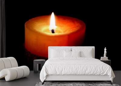 Burning candle flame on a dark background. Wall mural