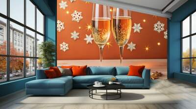 Festive background, two glasses of champagne, golden glitter of stars and snowflakes. Wall mural