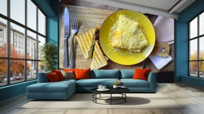 Breakfast in coffee 2 toasts and scrambled eggs with cheese. Flat lay Wall mural