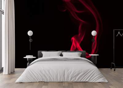 Red smoke on a black background. Copy space Wall mural