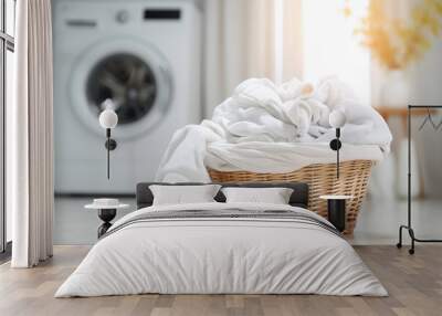 basket with white clothes on the floor in front of a blurry washing machine in the background Wall mural