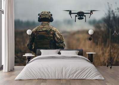 Soldier operating drone in combat zone Wall mural