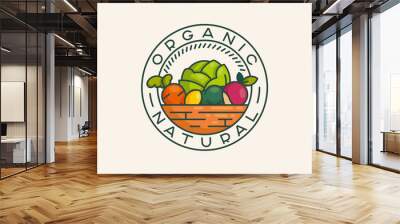 The logo design concept of organically natural food. Vintage logo vegetables and fruits in the basket. Healthy foods for proper nutrition. Wall mural