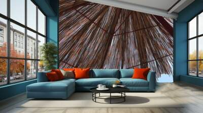 straw umbrella on the beach Wall mural