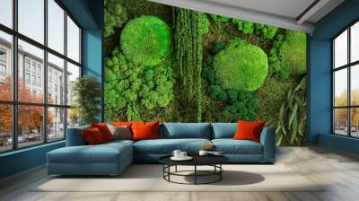 background of green moss on the wall in the form of a picture. texture of green eco-friendly moss close-up Wall mural